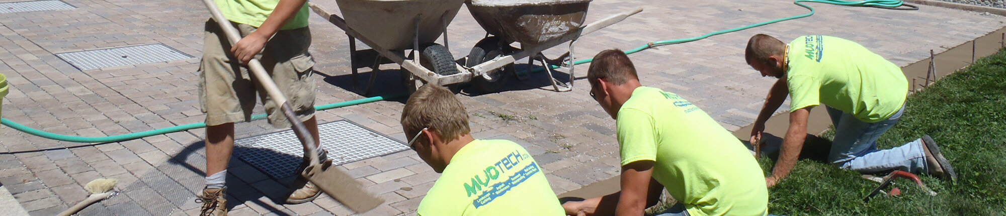 MUDTeCH technicians at work on a pavement repair job.